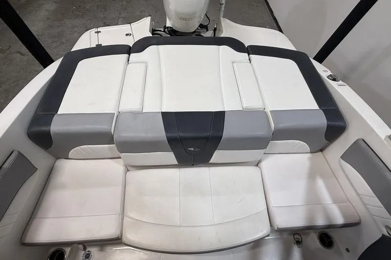 Slide: The Image of 2019 Chaparral 23 H2O Sport boat interior with white and gray seating. - 7