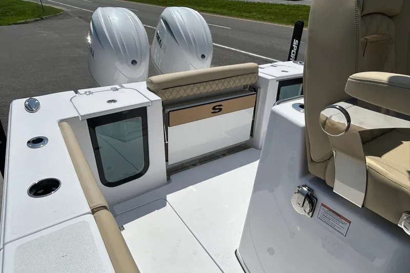 Slide: The Image of 2026 Sportsman Open 262 Center Console boat interior with dual engines and seating. - 6