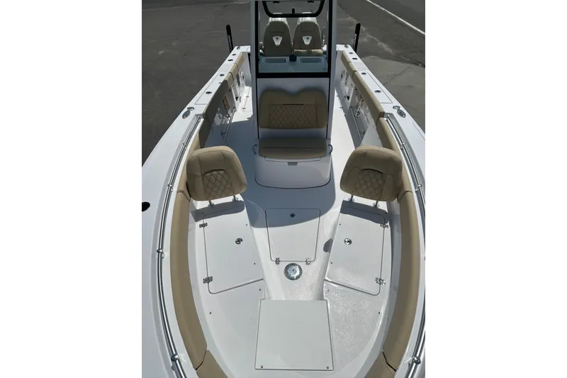 Slide: The Image of 2026 Sportsman Open 262 Center Console boat with beige seating and spacious deck. - 5