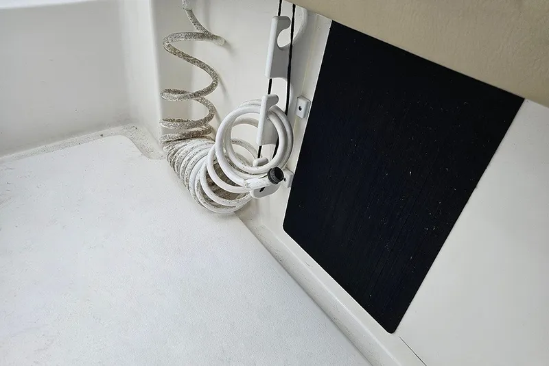 Slide: The Image of Coiled hose on 2021 Tidewater 232 CC Adventure boat deck. - 25