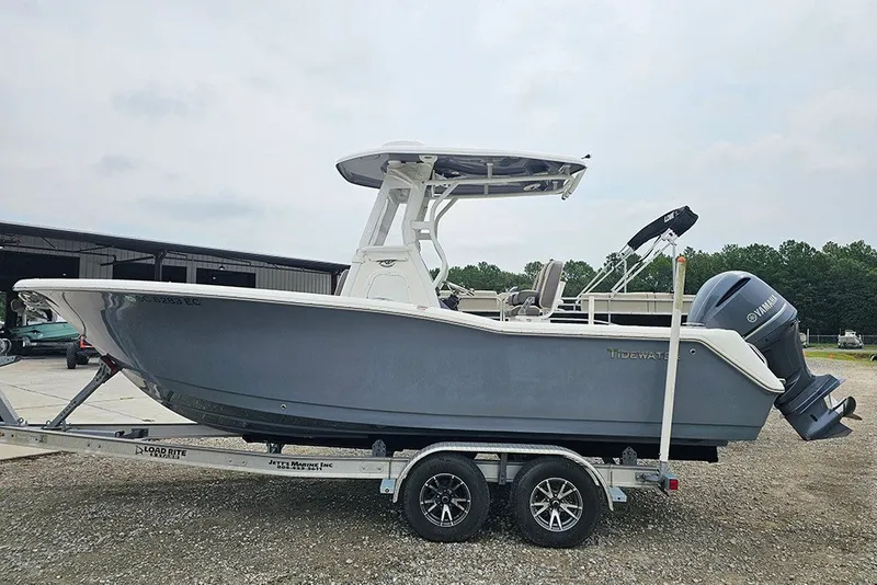 The Image of 2021 Tidewater 232 CC Adventure boat on trailer, parked outdoors. - 1