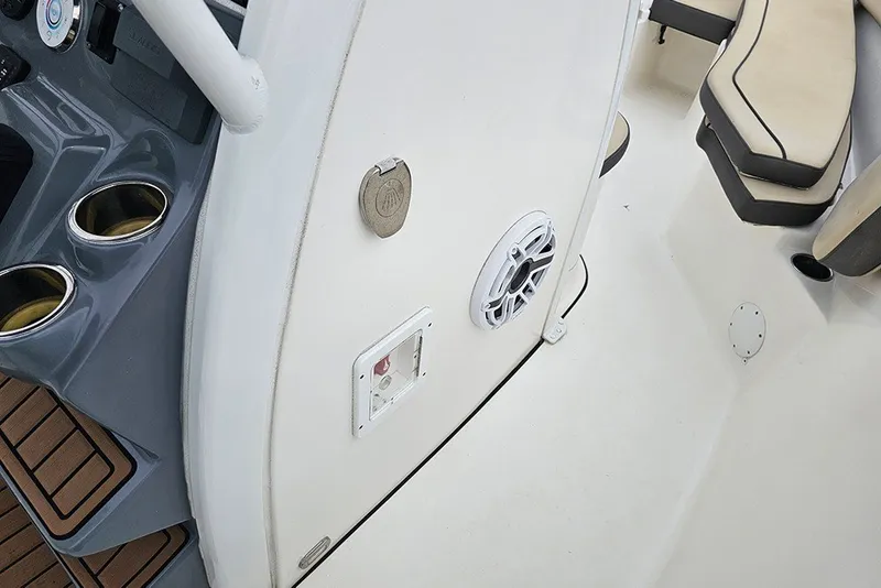 Slide: The Image of 2021 Tidewater 232 CC Adventure boat interior with cup holders and seating. - 26
