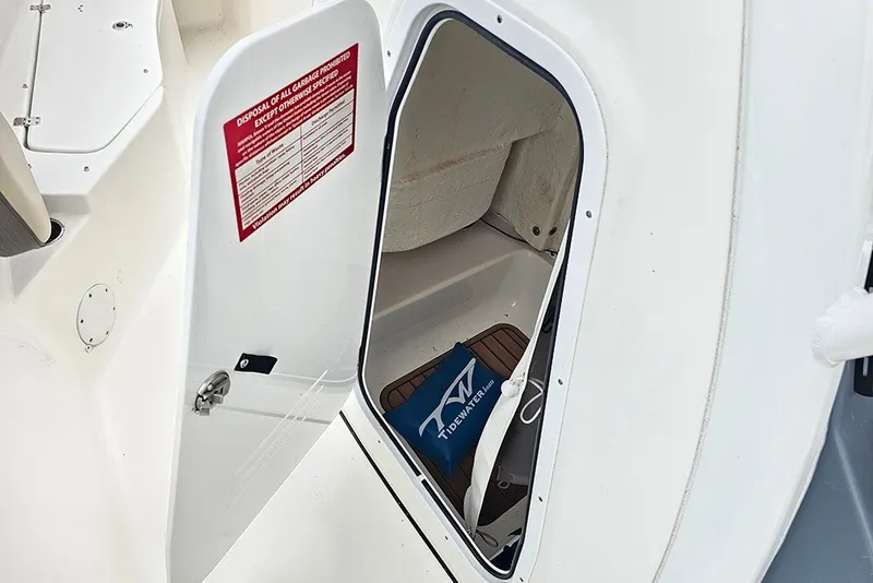 Slide: The Image of Open storage compartment on 2021 Tidewater 232 CC Adventure boat. - 20
