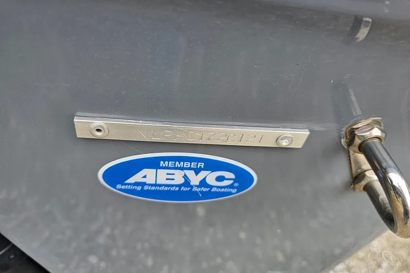 Slide: The Image of 2021 Tidewater 232 CC Adventure boat with ABYC member sticker and serial number plate. - 28