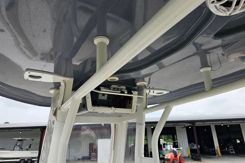 Slide: The Image of 2021 Tidewater 232 CC Adventure boat's T-top and electronics detail. - 17