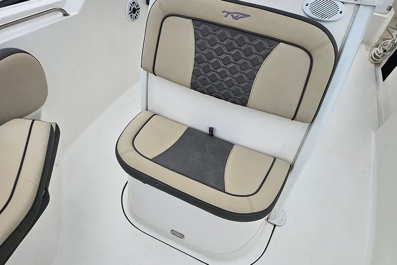 Slide: The Image of 2021 Tidewater 232 CC Adventure boat seat with beige and black upholstery. - 23