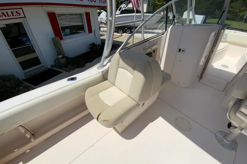 Slide: The Image of 2011 Grady-White Freedom 255 boat interior with seating and helm area. - 15