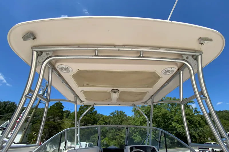 Slide: The Image of 2011 Grady-White Freedom 255 boat canopy and frame under clear blue sky. - 24