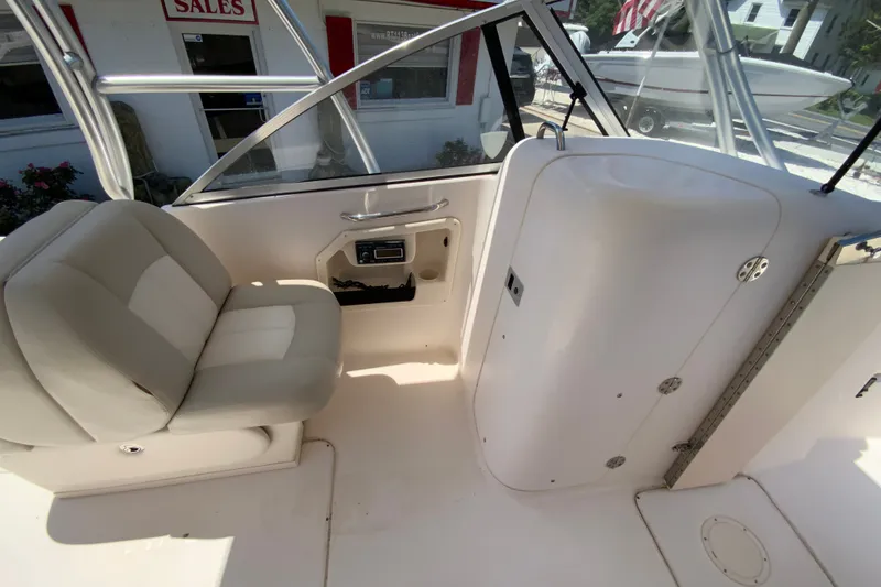 Slide: The Image of Interior of 2011 Grady-White Freedom 255 boat with seating and storage compartments. - 13