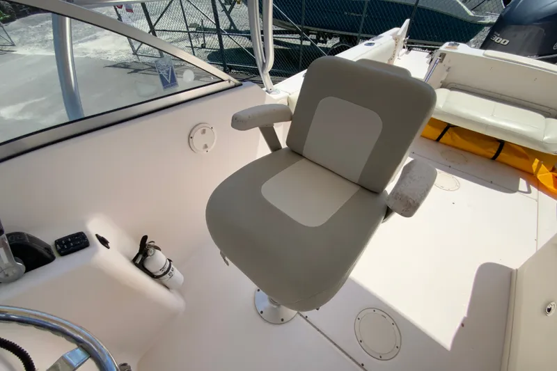 Slide: The Image of Captain's chair on 2011 Grady-White Freedom 255 boat, featuring a comfortable design. - 16