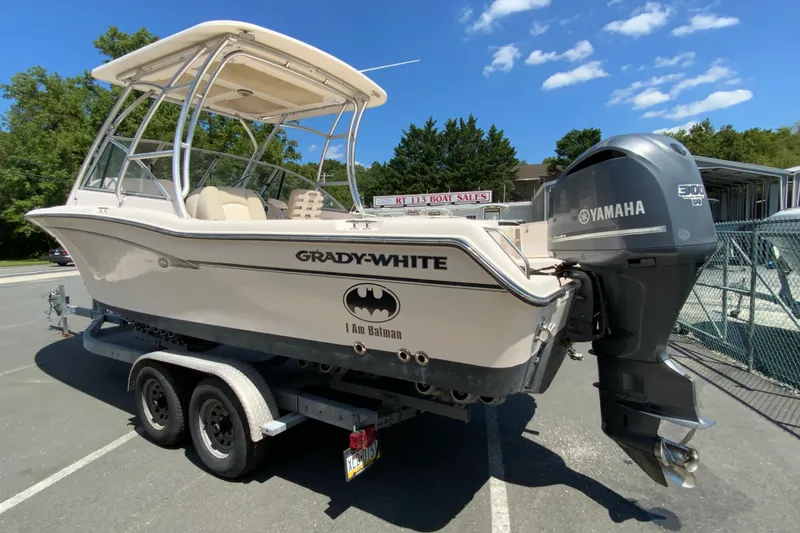 Slide: The Image of 2011 Grady-White Freedom 255 boat on trailer with Yamaha engine, sunny day. - 7