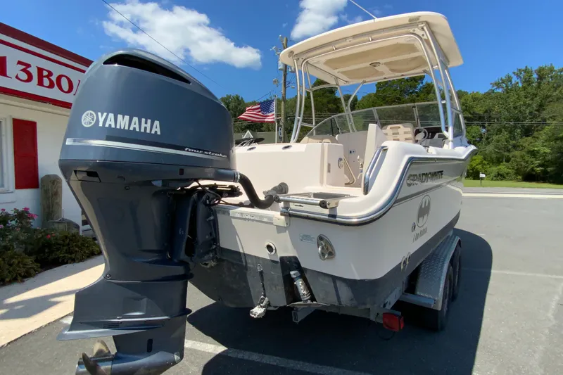 Slide: The Image of 2011 Grady-White Freedom 255 boat with Yamaha outboard motor in a parking lot. - 9