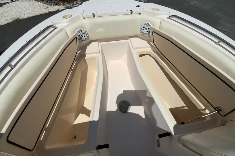 Slide: The Image of 2011 Grady-White Freedom 255 boat interior with seating and storage compartments. - 18