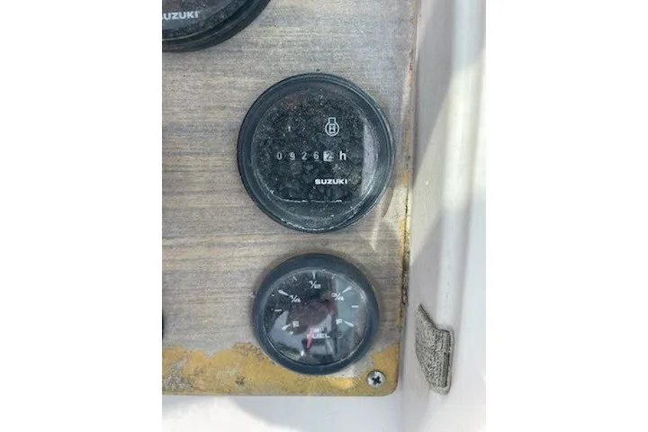 Slide: The Image of Dashboard gauges of a 1990 Grady-White Tournament 192 boat. - 9