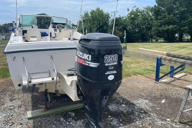 Slide: The Image of 1990 Grady-White Tournament 192 boat with Suzuki 250 outboard motor. - 2