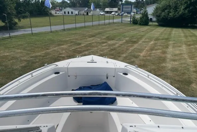Slide: The Image of 1990 Grady-White Tournament 192 boat bow view on grassy area. - 6