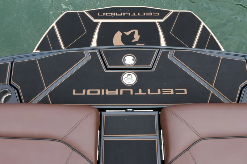 Slide: The Image of 2026 Centurion Ri265 boat deck with brown seating and sleek design. - 14