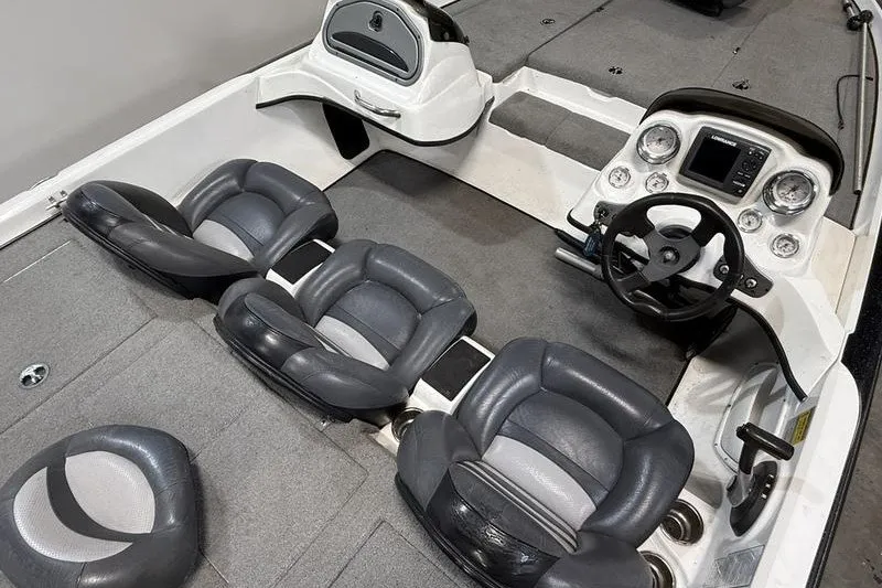 Slide: The Image of 2009 Nitro Z-7 boat interior with gray seating and modern dashboard controls. - 5
