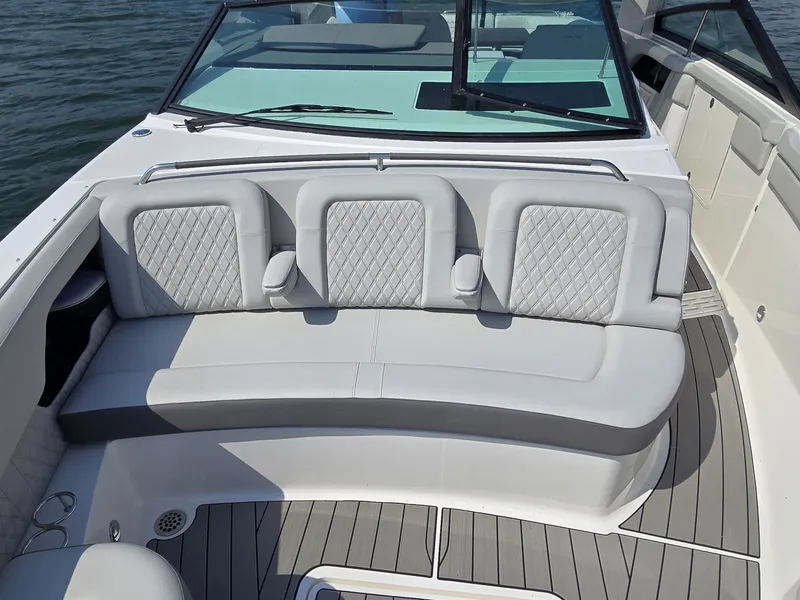 Slide: The Image of The image shows the cockpit of a 2027 Sea Ray SLX 400 with sleek, upholstered seating. - 28