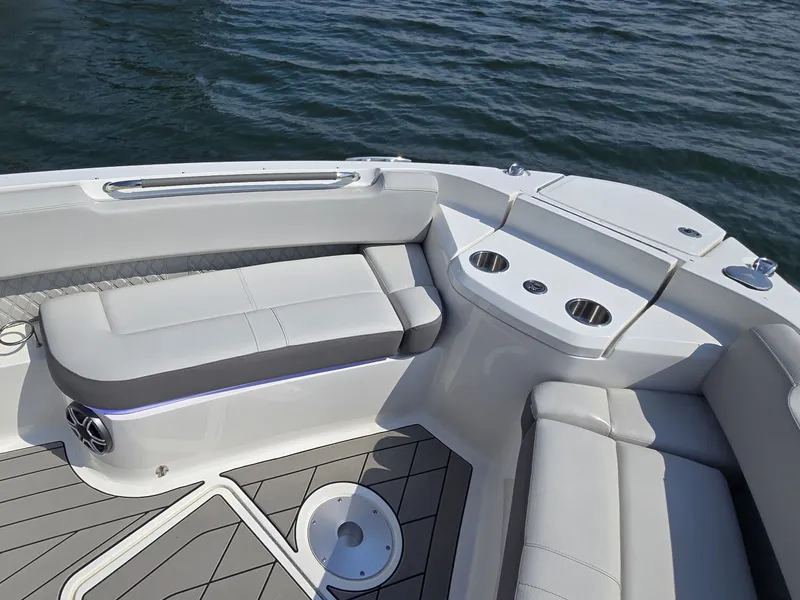 Slide: The Image of The image shows the cockpit of a 2027 Sea Ray SLX 400 with sleek seating and cup holders. - 31