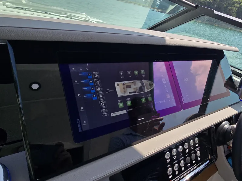 Slide: The Image of The image shows the modern dashboard of a Sea Ray SLX 400 with digital displays. - 26