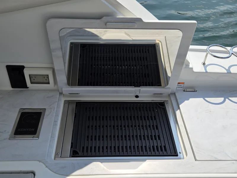 Slide: The Image of A grill on a boat with a marble surface and an outlet nearby. - 18