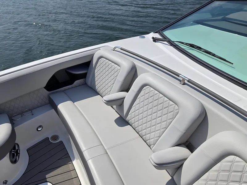 Slide: The Image of The 2027 Sea Ray SLX 400 features a luxurious, cushioned bench seat with elegant stitching. - 29