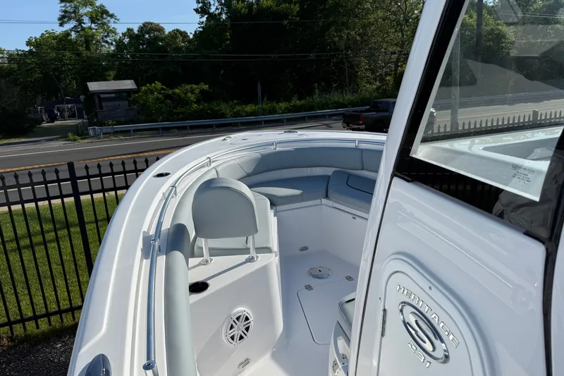 Slide: The Image of 2026 Sportsman Heritage 231 Center Console boat interior with seating and console view. - 6