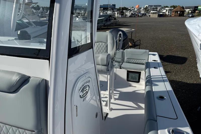 Slide: The Image of 2026 Sportsman Heritage 231 Center Console boat interior with seating and console details. - 5