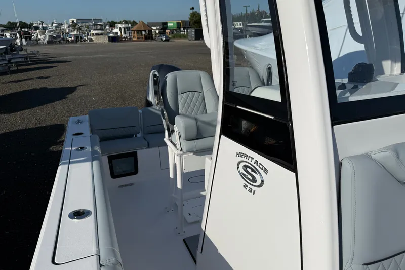 Slide: The Image of 2026 Sportsman Heritage 231 Center Console boat, featuring sleek design and comfortable seating. - 4