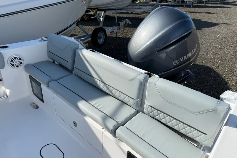 Slide: The Image of 2026 Sportsman Heritage 231 Center Console boat with Yamaha engine and cushioned seating. - 9