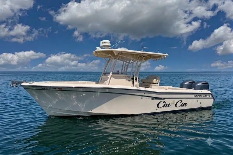 Slide: The Image of 2014 Grady-White Canyon 283 boat on calm ocean under blue sky with clouds. - 37