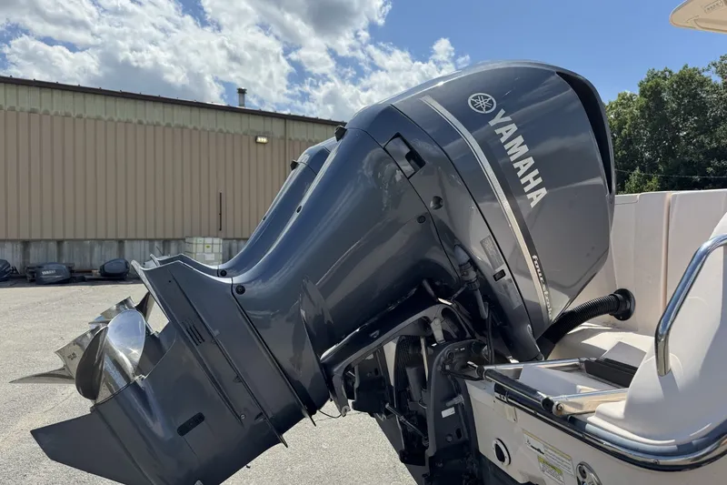 Slide: The Image of 2014 Grady-White Canyon 283 with Yamaha outboard motor in a sunny outdoor setting. - 30