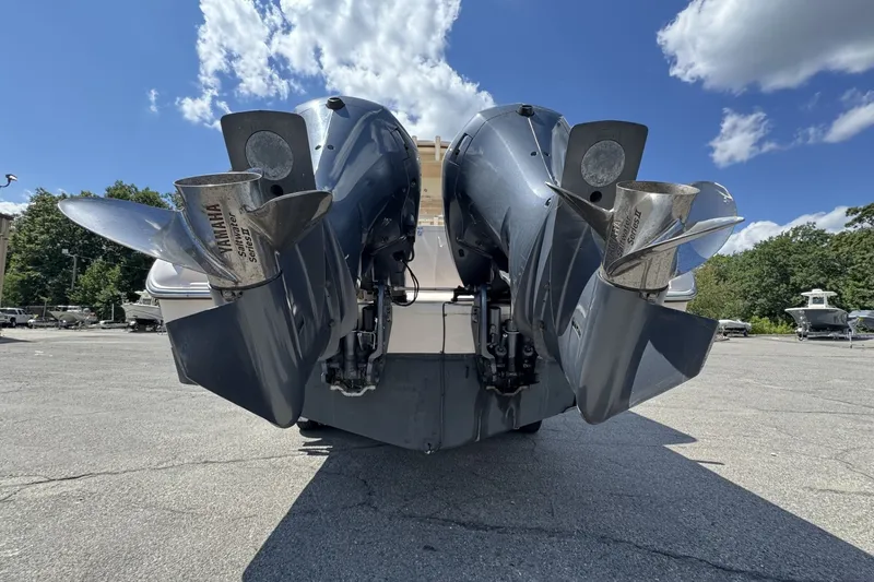 Slide: The Image of 2014 Grady-White Canyon 283 boat with Yamaha outboard engines, parked outdoors. - 29