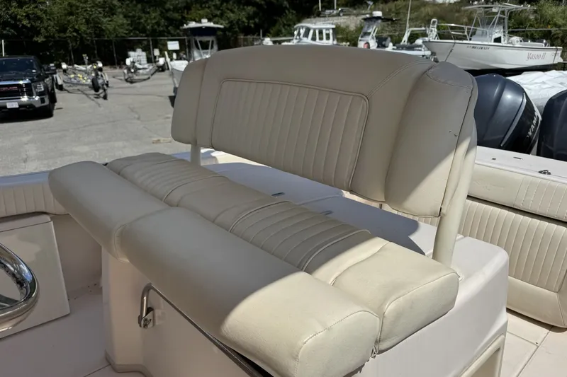 Slide: The Image of 2014 Grady-White Canyon 283 boat seating area with beige upholstery. - 28