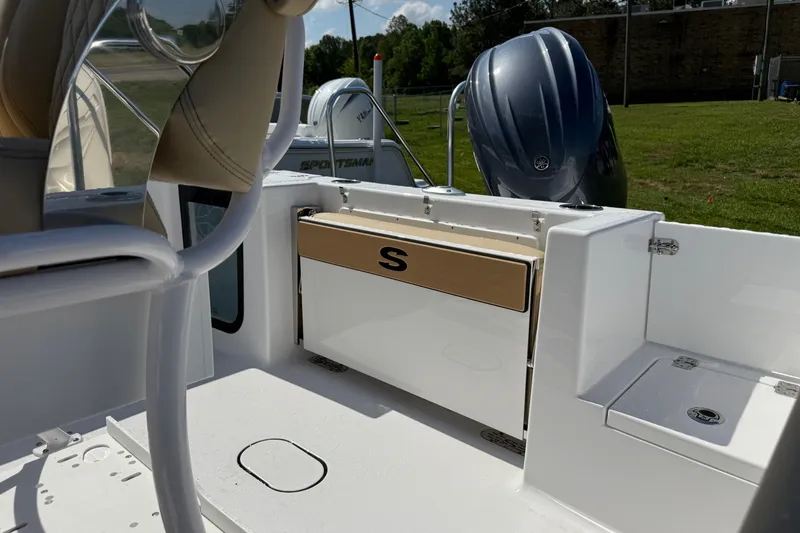 Slide: The Image of 2026 Sportsman Open 212 Center Console boat interior with seating and engine view. - 3