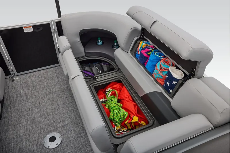 Slide: The Image of Manufacturer Provided Image: 2026 Sun Tracker Party Barge 22 RF DLX storage compartments with towels and gear. - 25