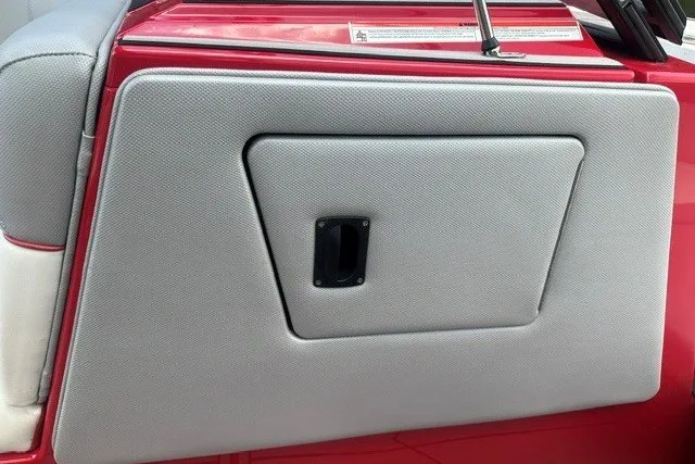 Slide: The Image of 2021 Moomba Kaiyen boat interior with red and gray upholstery detail. - 20