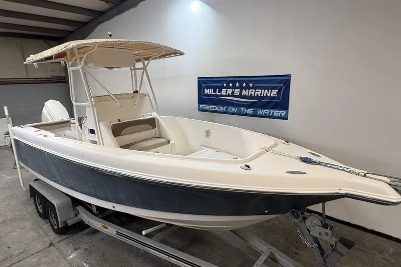 Slide: The Image of 2000 Pro-Line 23 Sport boat on trailer at Miller's Marine showroom. - 2