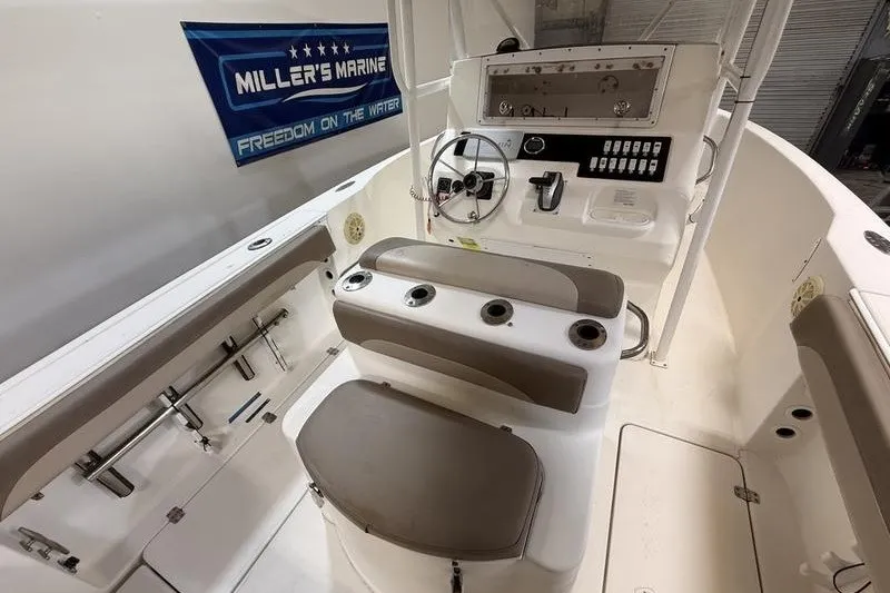 Slide: The Image of 2000 Pro-Line 23 Sport boat interior with steering console and seating. - 9