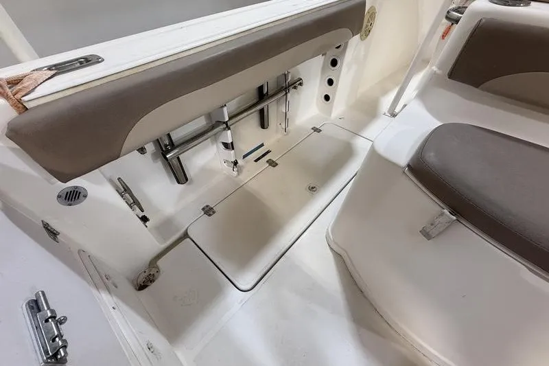 Slide: The Image of Interior view of a 2000 Pro-Line 23 Sport boat, featuring seating and storage compartments. - 6