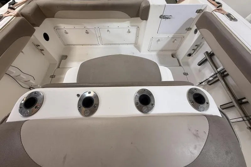 Slide: The Image of Interior of a 2000 Pro-Line 23 Sport boat showing seating and rod holders. - 8