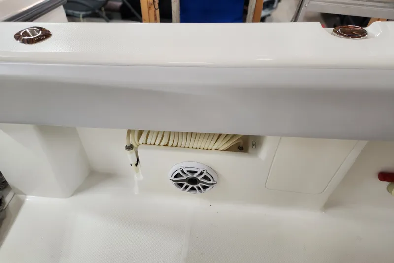 Slide: The Image of 2024 SeaVee 322Z boat interior detail with speaker and coiled hose. - 17