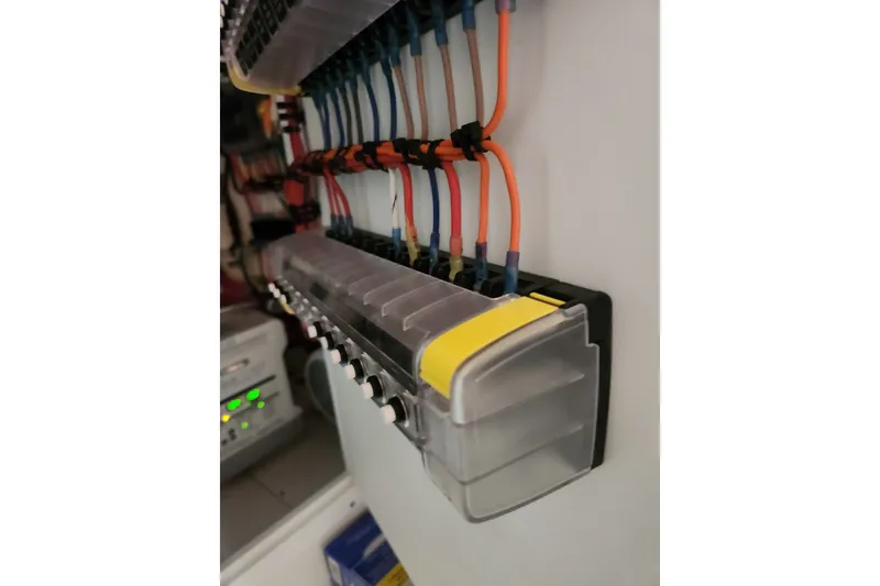Slide: The Image of Electrical panel with colorful wiring in a 2024 SeaVee 322Z boat. - 10