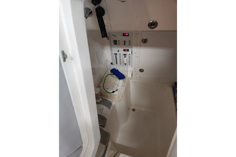 Slide: The Image of 2024 SeaVee 322Z interior cabin with control panel and storage area. - 8
