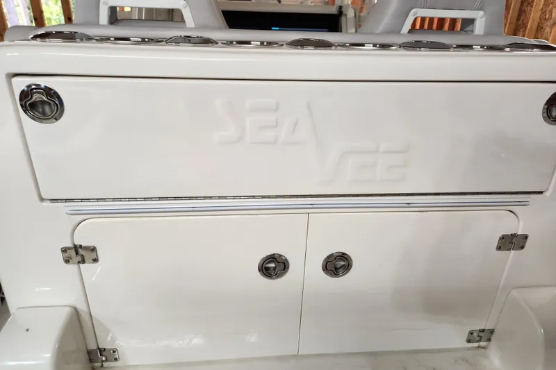 Slide: The Image of 2024 SeaVee 322Z boat storage compartment with embossed logo and stainless steel hardware. - 14