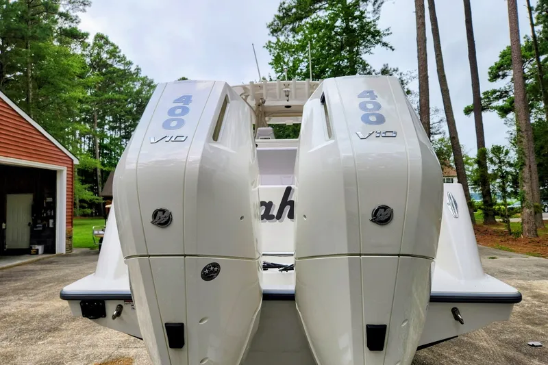 Slide: The Image of 2024 SeaVee 322Z boat with dual 400 V10 engines, parked outdoors. - 18