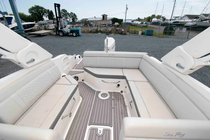 Slide: The Image of 2024 Sea Ray SDX 270 Outboard boat interior with spacious seating and elegant design. - 6