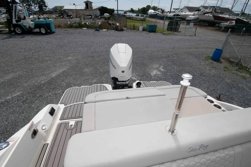 Slide: The Image of 2024 Sea Ray SDX 270 Outboard boat with sleek design and powerful engine in a marina. - 8