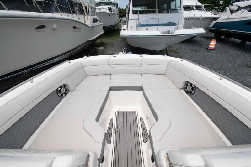 Slide: The Image of 2024 Sea Ray SDX 270 Outboard boat interior with spacious seating and sleek design. - 7